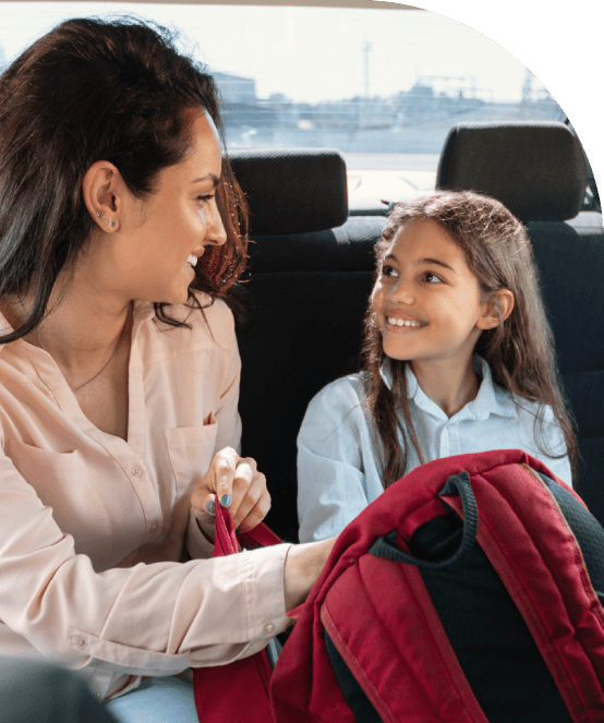 Mother and daughter riding together in a local Brooklyn car service.